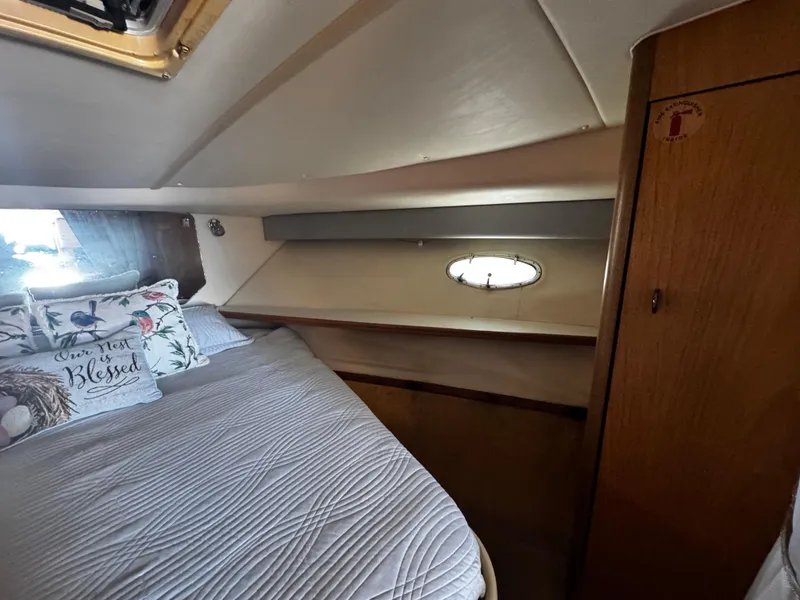 Slide: The Image of Cozy cabin interior of 2000 Tiara Yachts 3500 Open with bed and porthole. - 40