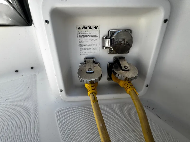 Slide: The Image of Power connections on a 2000 Tiara Yachts 3500 Open boat with yellow cables. - 41