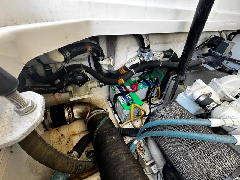 Slide: The Image of Engine compartment of a 2000 Tiara Yachts 3500 Open, showcasing wiring and components. - 44
