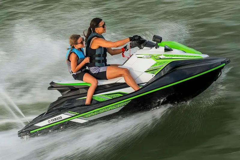 Slide: The Image of 2020 Yamaha WaveRunner EX Deluxe in a garage, featuring a sleek blue and gray design. - 2