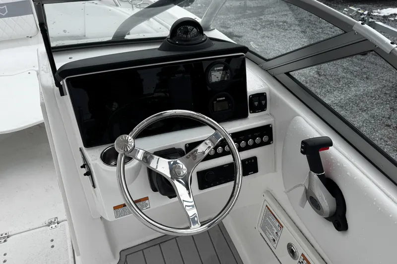 Slide: The Image of 2026 Sea Fox 228 Traveler boat interior with white cushioned seating. - 10