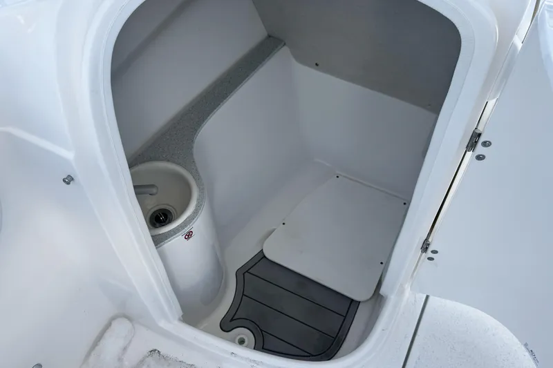 Slide: The Image of 2026 Sea Fox 228 Traveler boat interior with steering wheel and seating area. - 12