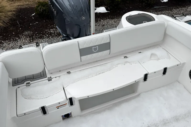 Slide: The Image of 2026 Sea Fox 228 Traveler boat interior with white seating and storage compartments. - 13