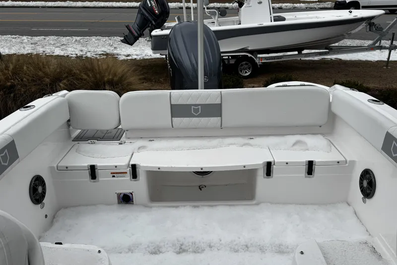 Slide: The Image of 2026 Sea Fox 228 Traveler boat interior with dual white seats and modern dashboard. - 14