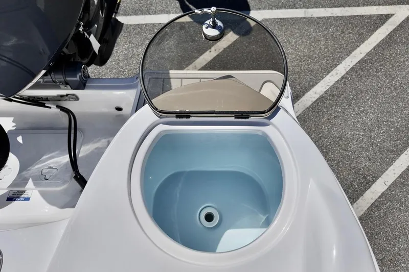 Slide: The Image of Livewell on 2026 Sea Fox 228 Traveler boat, open lid, blue interior. - 21