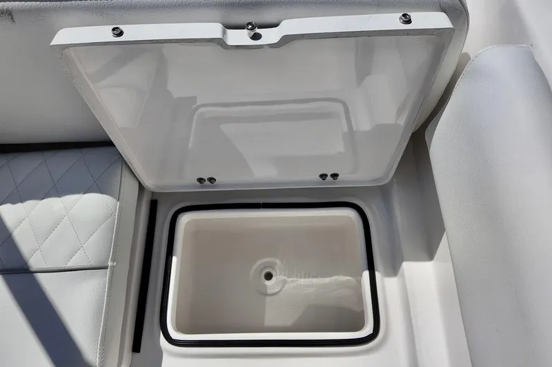 Slide: The Image of Open storage compartment on 2026 Sea Fox 228 Traveler boat, featuring cushioned seating. - 22