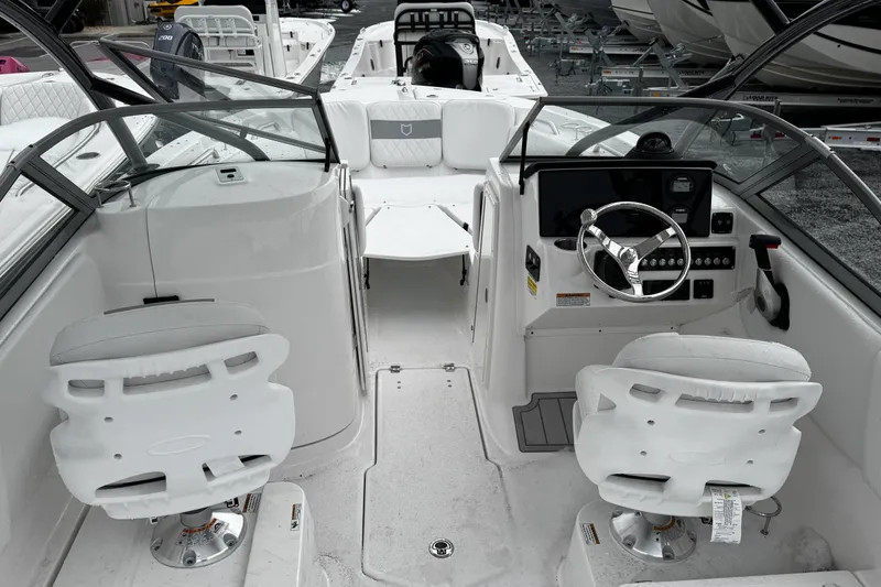 Slide: The Image of 2026 Sea Fox 228 Traveler boat interior with steering wheel and seating. - 7
