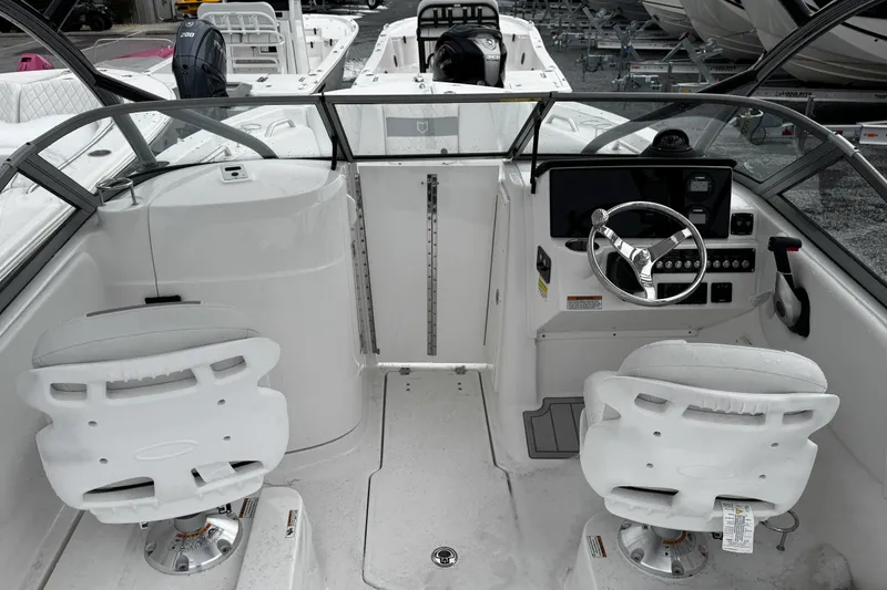 Slide: The Image of 2026 Sea Fox 228 Traveler boat storage compartment with open lid, showcasing interior space. - 8