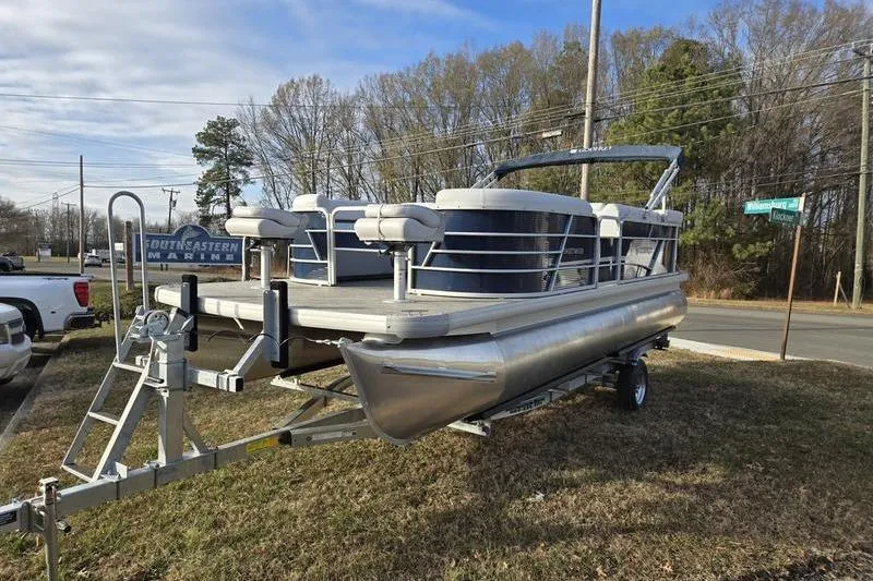 Slide: The Image of 2022 Godfrey Sweetwater 2286 BF pontoon boat on trailer, parked outdoors. - 3