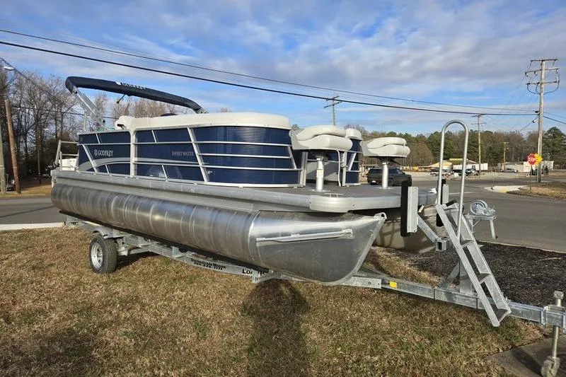 Slide: The Image of 2022 Godfrey Sweetwater 2286 BF pontoon boat on trailer, parked outdoors. - 4