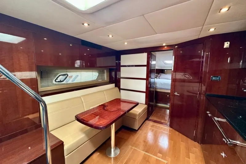 Slide: The Image of Luxurious interior of 2011 Sea Ray 450 Sundancer yacht with elegant wood finishes. - 11