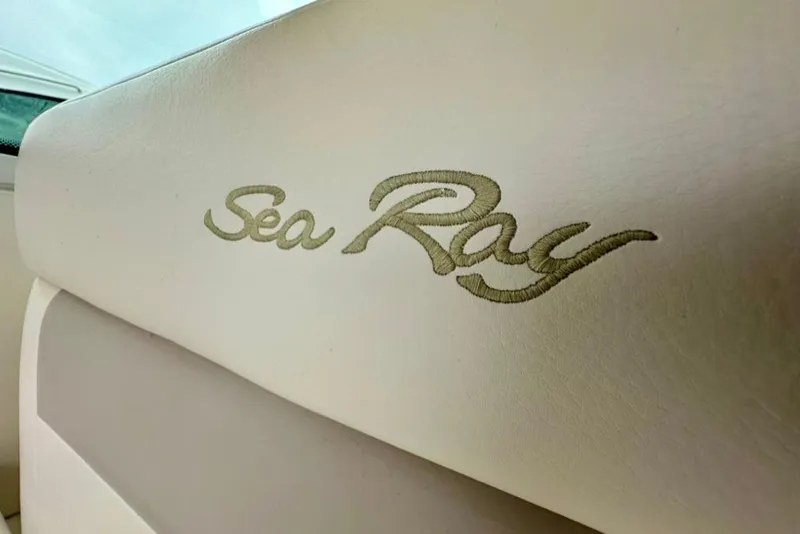 Slide: The Image of Embroidered Sea Ray logo on 2011 Sea Ray 450 Sundancer boat seat. - 26