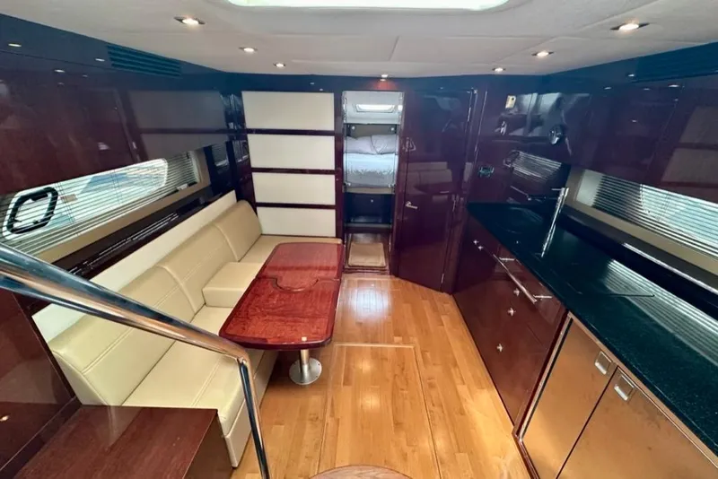 Slide: The Image of Luxurious interior of 2011 Sea Ray 450 Sundancer yacht with elegant wood finishes. - 27