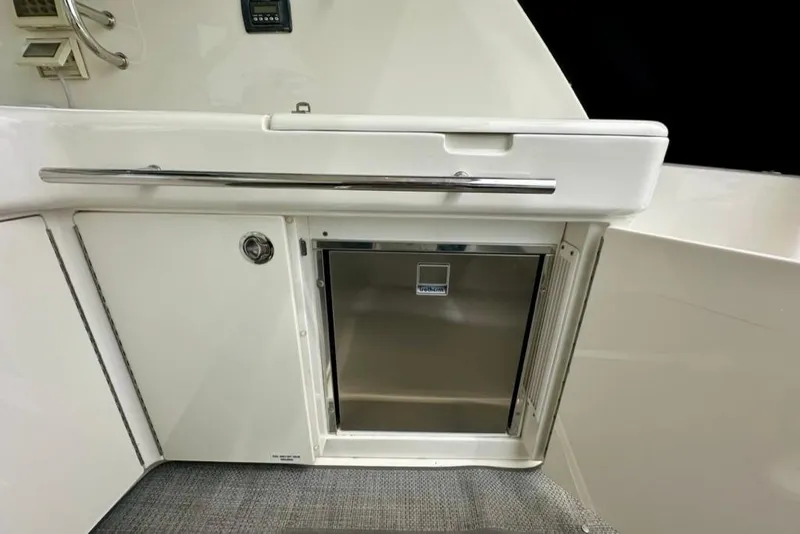 Slide: The Image of 2011 Sea Ray 450 Sundancer yacht interior with stainless steel mini fridge. - 32