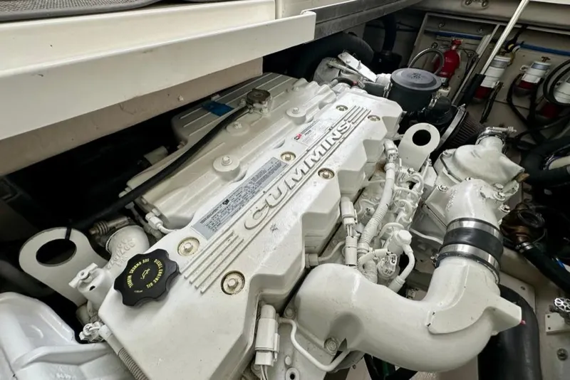 Slide: The Image of Cummins engine in 2011 Sea Ray 450 Sundancer yacht, showcasing detailed components. - 38