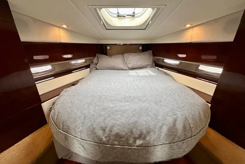 Slide: The Image of Luxurious cabin interior of 2011 Sea Ray 450 Sundancer yacht with cozy bed. - 4