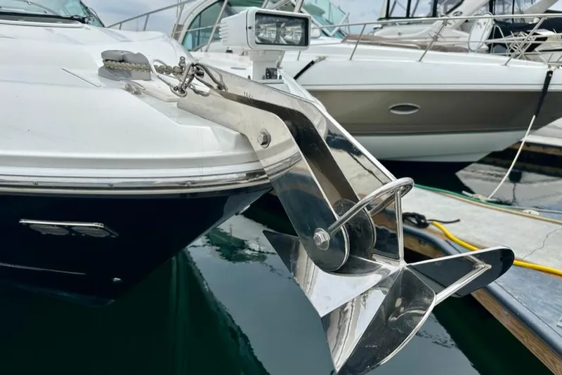 Slide: The Image of 2011 Sea Ray 450 Sundancer yacht with polished anchor at marina. - 41