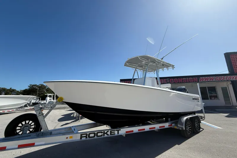 The Image of 2026 Contender 25 Tournament boat on trailer under clear blue sky. - 0