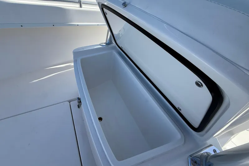 Slide: The Image of Open storage compartment on 2026 Contender 25 Tournament boat, showcasing spacious interior. - 10