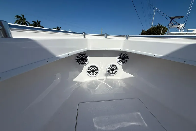 Slide: The Image of 2026 Contender 25 Tournament boat interior with four speakers, sleek white design. - 13