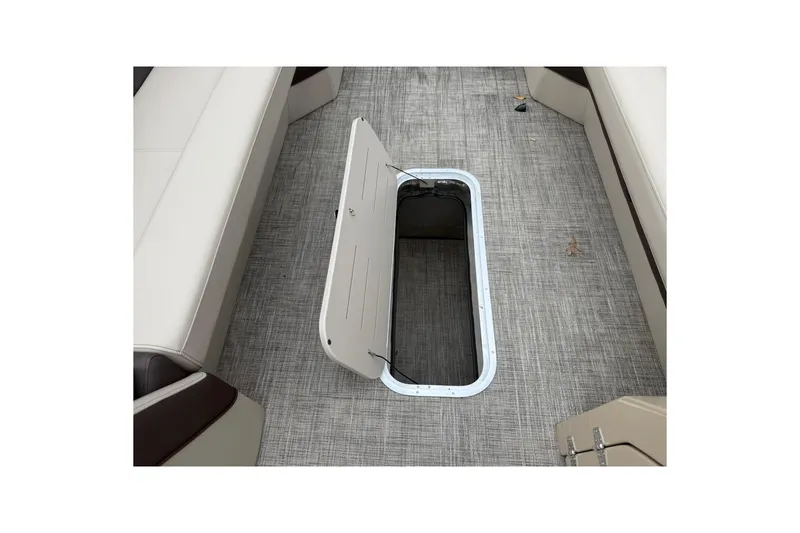 Slide: The Image of 2026 Bentley Pontoons Elite 253 Swingback interior storage compartment open on deck. - 10