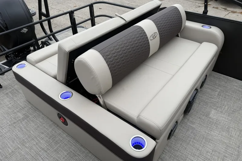 Slide: The Image of 2026 Bentley Pontoons Elite 253 Swingback with luxurious seating and illuminated cup holders. - 16