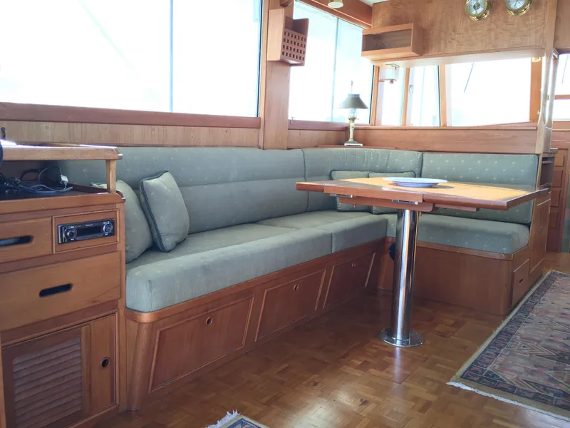 Slide: The Image of Interior of 1982 Grand Banks 42 Europa yacht with wooden furniture and seating area. - 13