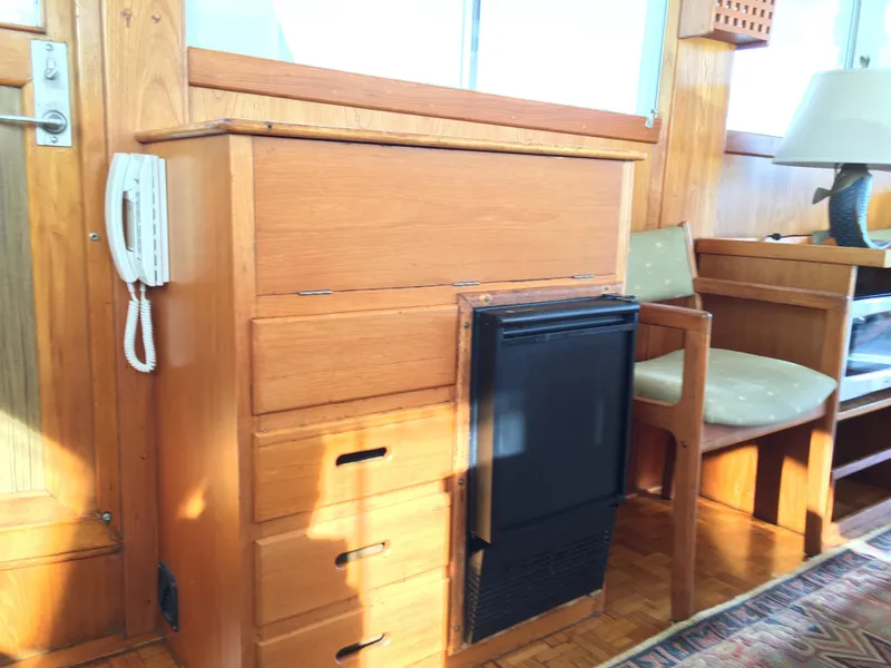 Slide: The Image of Interior of 1982 Grand Banks 42 Europa with wooden furniture. - 16
