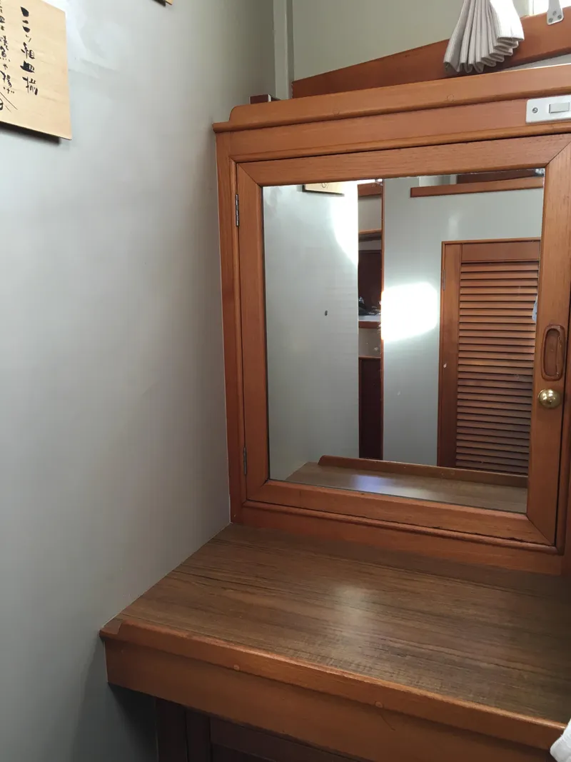 Slide: The Image of Wooden vanity with mirror on 1982 Grand Banks 42 Europa. - 41