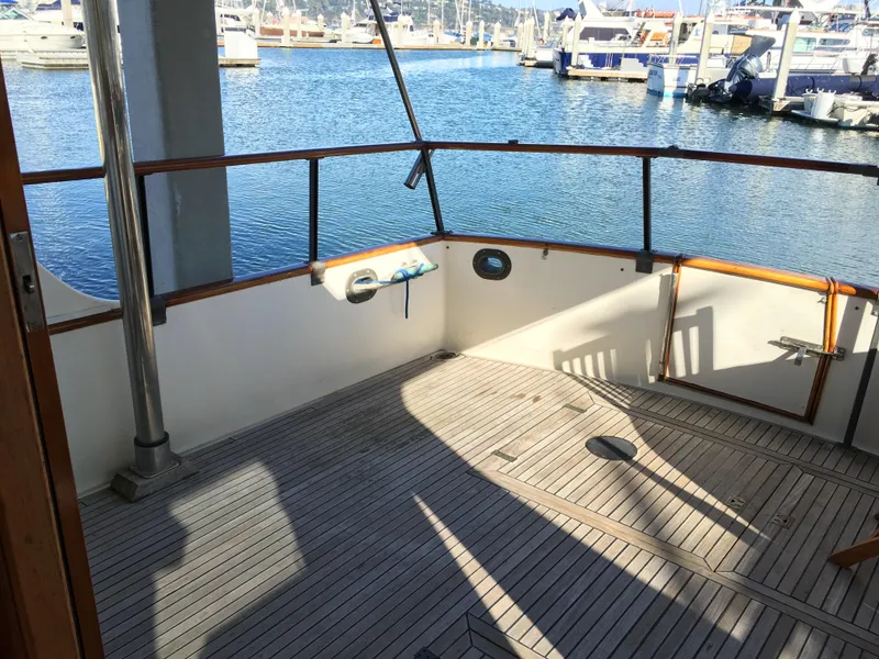 Slide: The Image of Grand Banks 42 Europa 1982 yacht deck with harbor view. - 8