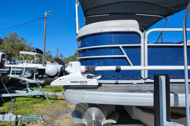 Slide: The Image of 2022 Godfrey Sweetwater 2286 SFL pontoon boat with Minn Kota Terrova motor, blue exterior. - 12
