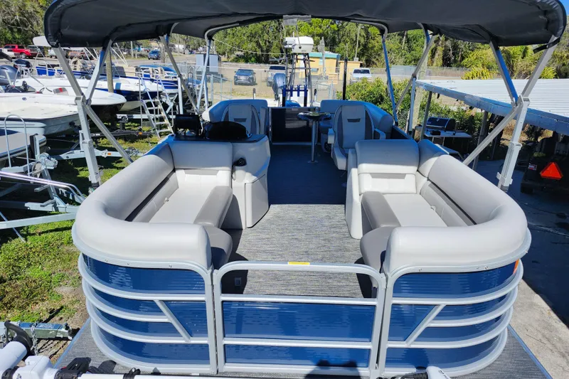 Slide: The Image of 2022 Godfrey Sweetwater 2286 SFL pontoon boat with spacious seating and canopy. - 14