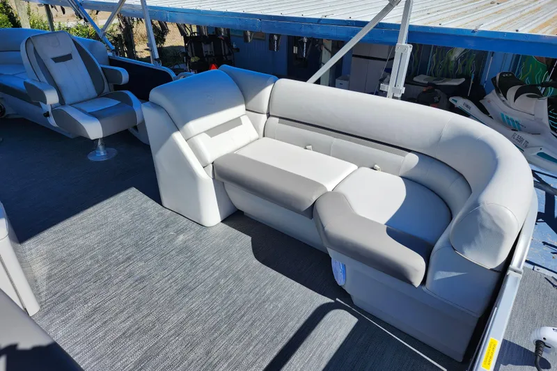 Slide: The Image of 2022 Godfrey Sweetwater 2286 SFL pontoon boat interior with plush seating and modern design. - 16