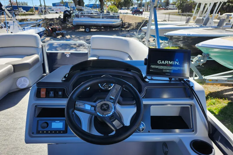 Slide: The Image of 2022 Godfrey Sweetwater 2286 SFL boat dashboard with Garmin navigation system. - 25