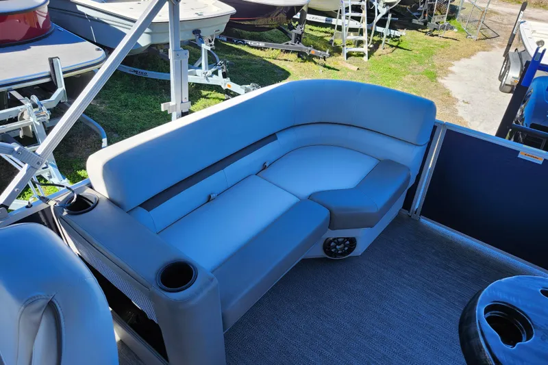 Slide: The Image of 2022 Godfrey Sweetwater 2286 SFL pontoon boat interior with plush seating and cup holders. - 29