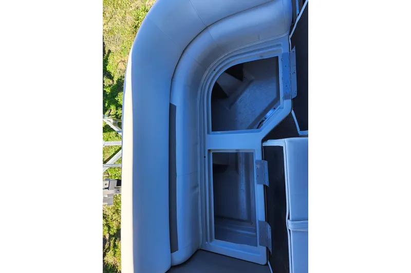 Slide: The Image of 2022 Godfrey Sweetwater 2286 SFL boat interior, featuring storage compartments and seating. - 30