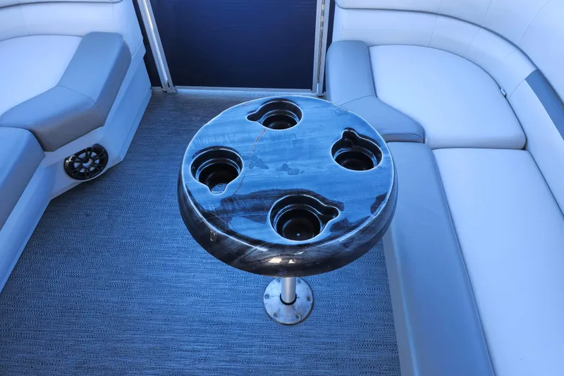 Slide: The Image of Interior of 2022 Godfrey Sweetwater 2286 SFL with round table and cushioned seating. - 32