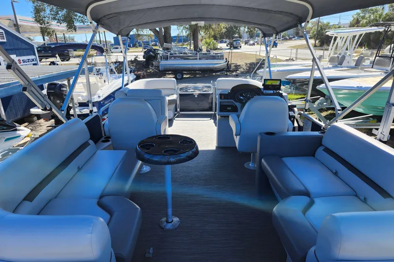 Slide: The Image of 2022 Godfrey Sweetwater 2286 SFL pontoon boat interior with seating and helm. - 33