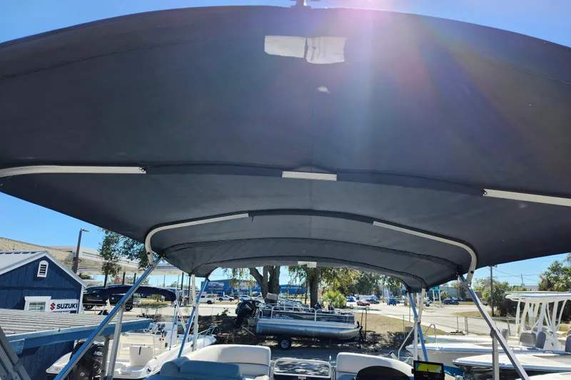 Slide: The Image of 2022 Godfrey Sweetwater 2286 SFL pontoon boat with canopy in outdoor setting. - 34