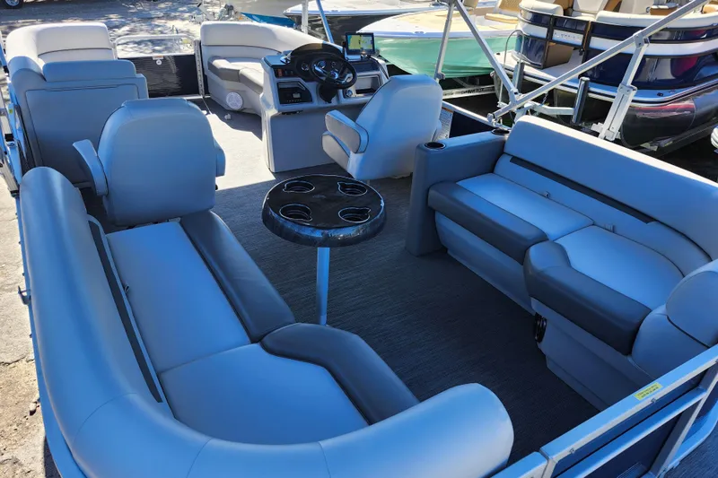 Slide: The Image of 2022 Godfrey Sweetwater 2286 SFL pontoon boat interior with spacious seating and modern helm. - 37