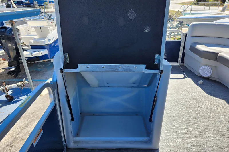 Slide: The Image of Open storage compartment on 2022 Godfrey Sweetwater 2286 SFL pontoon boat deck. - 40