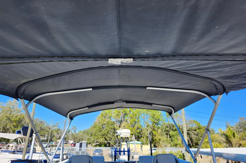 Slide: The Image of 2022 Godfrey Sweetwater 2286 SFL boat canopy under blue sky. - 41