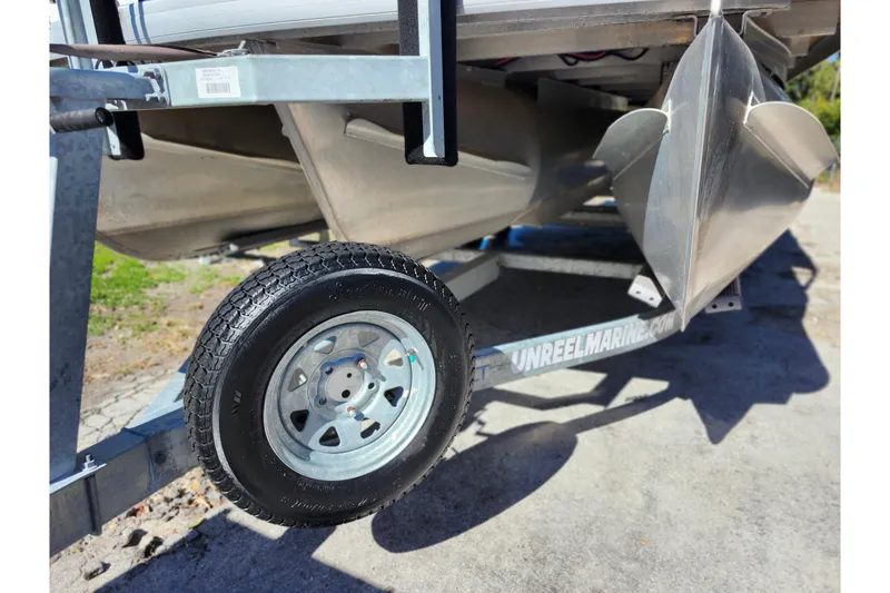 Slide: The Image of 2022 Godfrey Sweetwater 2286 SFL pontoon boat on trailer, close-up view. - 44