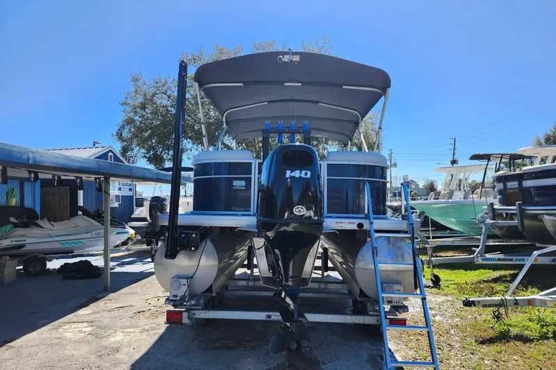 Slide: The Image of 2022 Godfrey Sweetwater 2286 SFL pontoon boat with Suzuki 140 engine on trailer. - 6