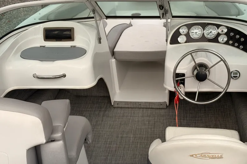 Slide: The Image of 2020 Caravelle 19 EBo Fish & Ski boat interior with steering wheel and dashboard. - 10