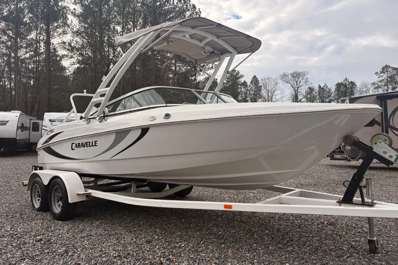 Slide: The Image of 2020 Caravelle 19 EBo Fish & Ski boat on trailer, parked outdoors. - 4