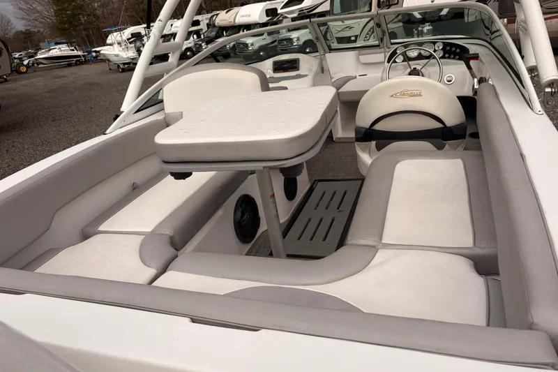 Slide: The Image of 2020 Caravelle 19 EBo Fish & Ski boat interior with seating and table. - 5