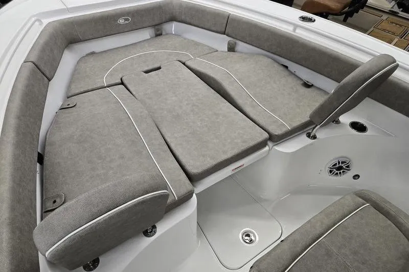 Slide: The Image of 2025 Sea Hunt Ultra 255 SE boat interior with cushioned seating and storage. - 4