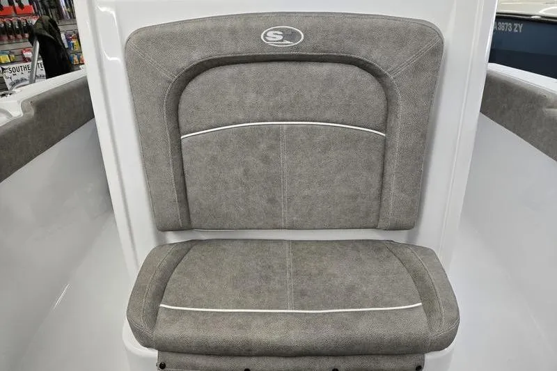Slide: The Image of 2025 Sea Hunt Ultra 255 SE boat seat with gray upholstery. - 7