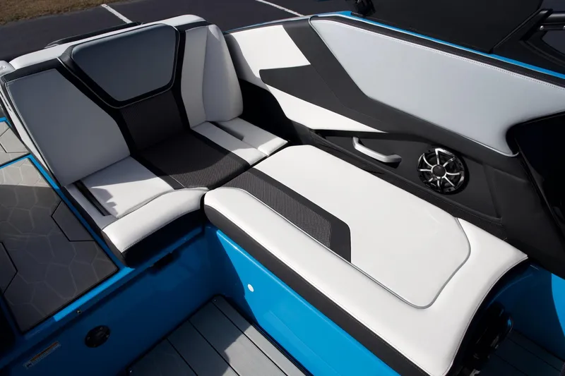 Slide: The Image of 2023 Yamaha Boats 255XD interior seating with sleek black and white design. - 13